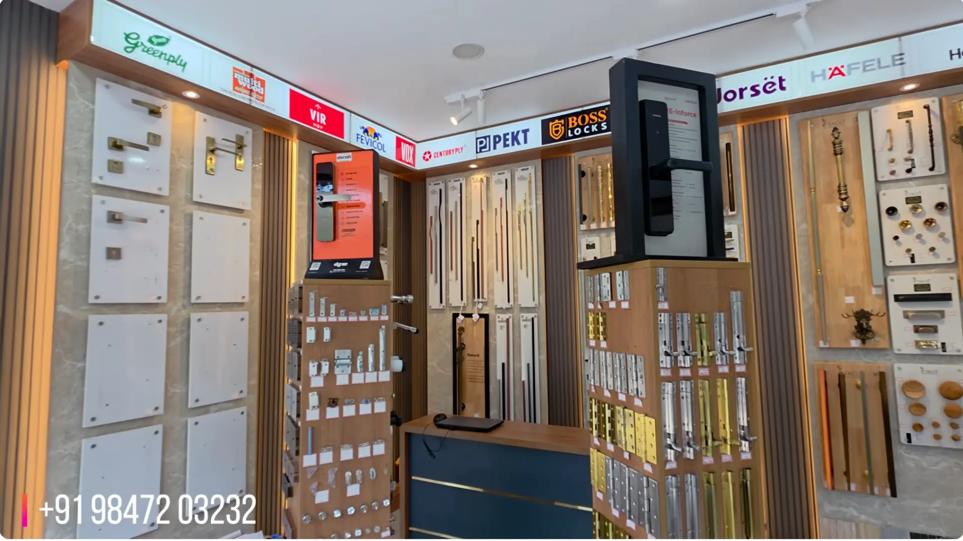 Digital door lock and hinge displays under Hafele, Dorset and Pekt brand signage at The Interior Mart